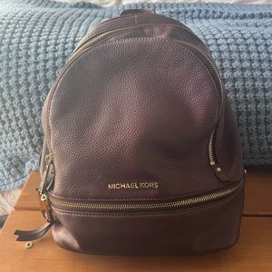 burgundy Michael Kors leather backpack